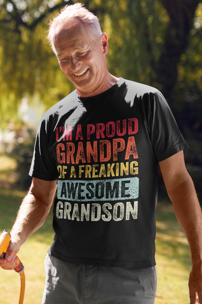 Vintage Funny I’m a Proud Grandpa of a Freaking Awesome Grandson Retro T-shirt, family-printondemand-t-shirt-being-worn-by-an-elder-man-maintaining-his-garden