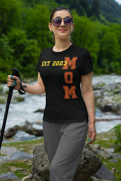 Funny Mom Est 2023 Cool T-shirt, gildan-t-shirt-mockup-featuring-a-woman-hiking-on-a-mountain