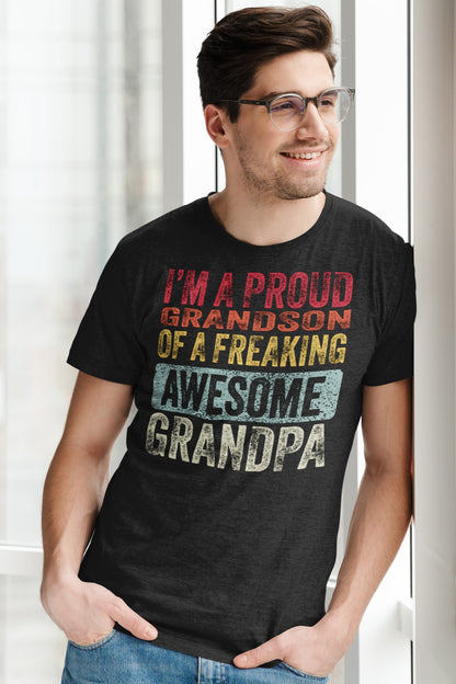 Vintage Funny I’m a Proud Grandson of a Freaking Awesome Grandpa Retro T-shirt, heather-t-shirt-of-a-smiling-man-leaning-on-a-wall