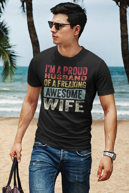 Vintage Funny I’m a Proud Husband of a Freaking Awesome Wife Retro T-shirt, mockup-of-a-man-with-sunglasses-wearing-a-t-shirt-at-the-beach