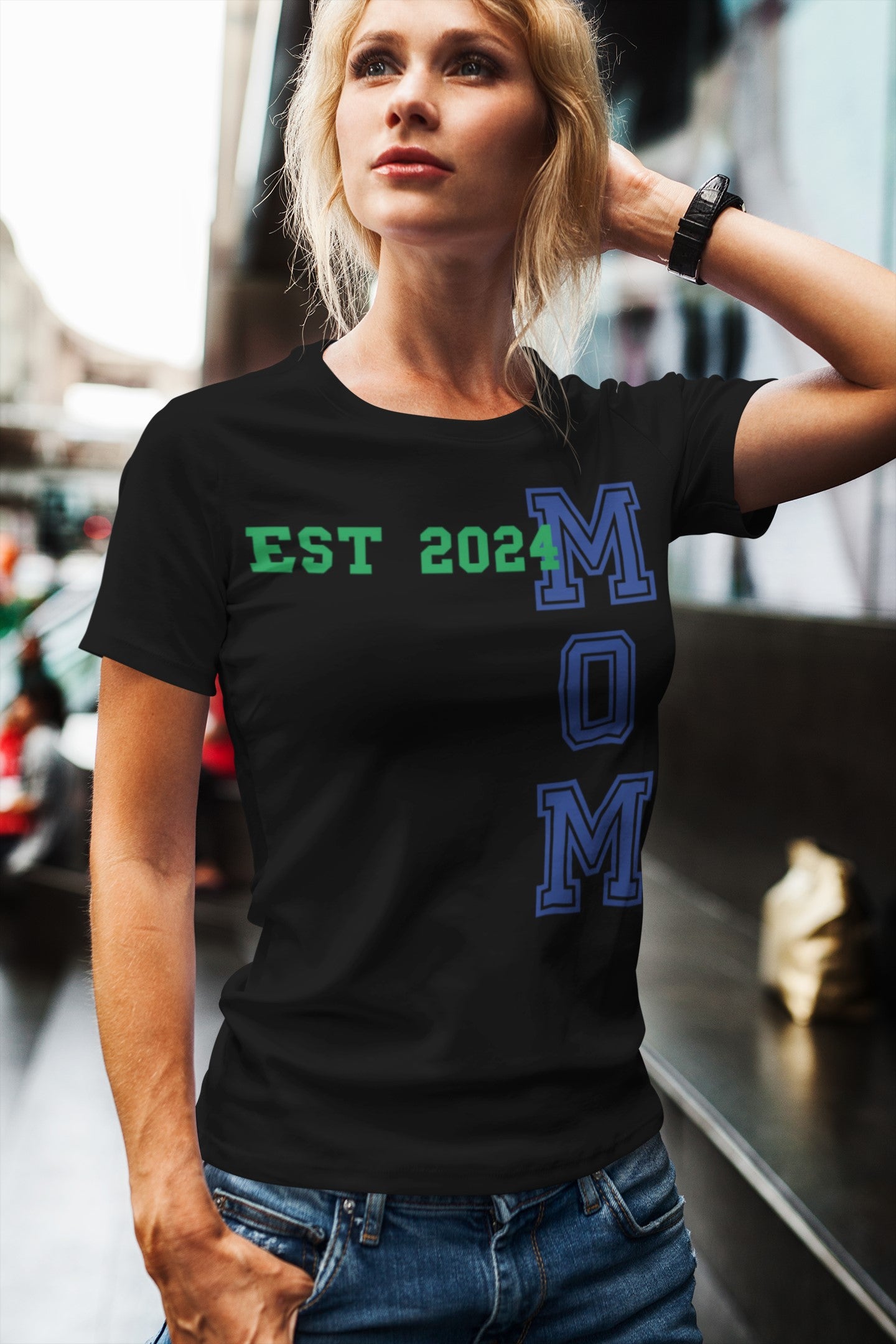 Funny Mom Est 2024 Cool T-shirt, mockup-of-a-woman-posing-with-a-t-shirt-in-the-city