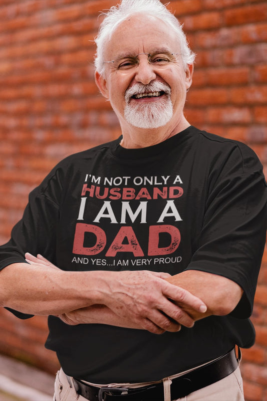 Funny I’m not only a Husband I am a Dad, and yes…I am very Proud T-shirt, round-neck-t-shirt-mockup-of-a-smiling-senior-man