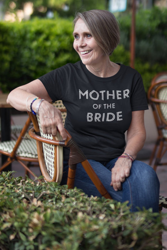 Funny Mother of the Bride T-shirt, smiling-senior-lady-wearing-a-t-shirt-mockup-at-a-cafe