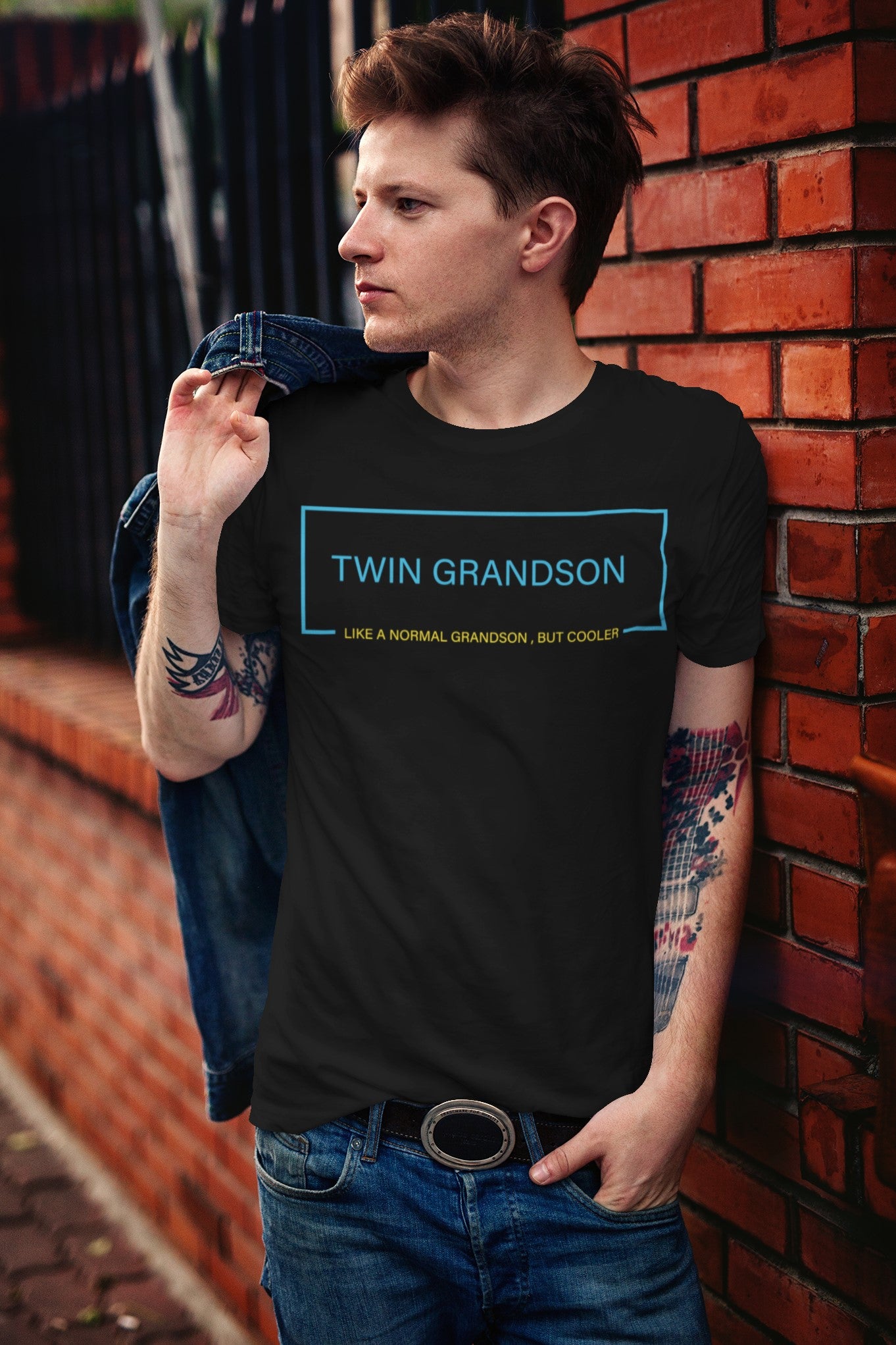 Funny Twin Grandson T-shirt, t-shirt-mockup-featuring-a-stylish-man-leaning-on-a-brick-wall